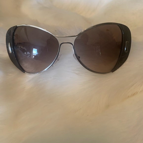 This is a pair of Prada sunglasses gently used. I would say overall in shape - Picture 2 of 3